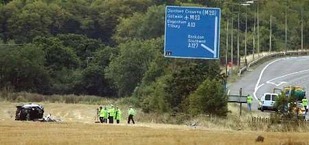 TRIPLE TRAGEDY: the wrecked vehicle in the field. Picture: STEPHEN HUNTLEY/ESSEX--PIX.COM