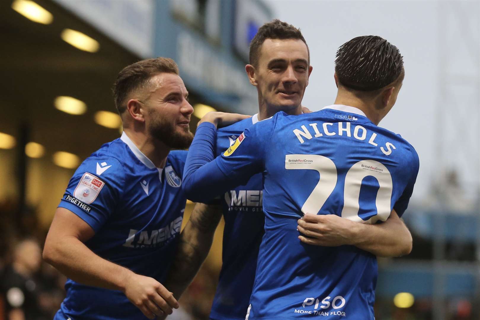 Gillingham's Alex MacDonald and Tom Nichols celebrate with goalscorer Shaun Williams