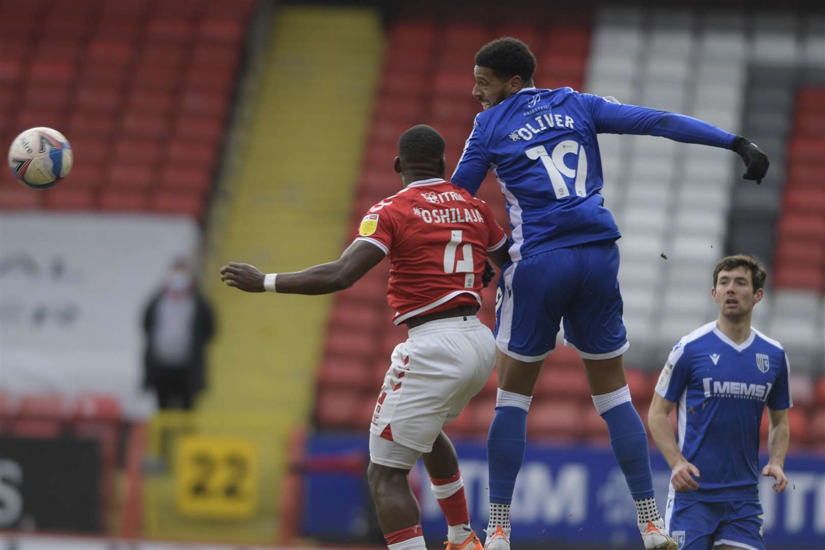 Gillingham striker Vadaine Oliver challenges ex-Gills defender Deji Oshilaja. Picture: Barry Goodwin. (44403579)