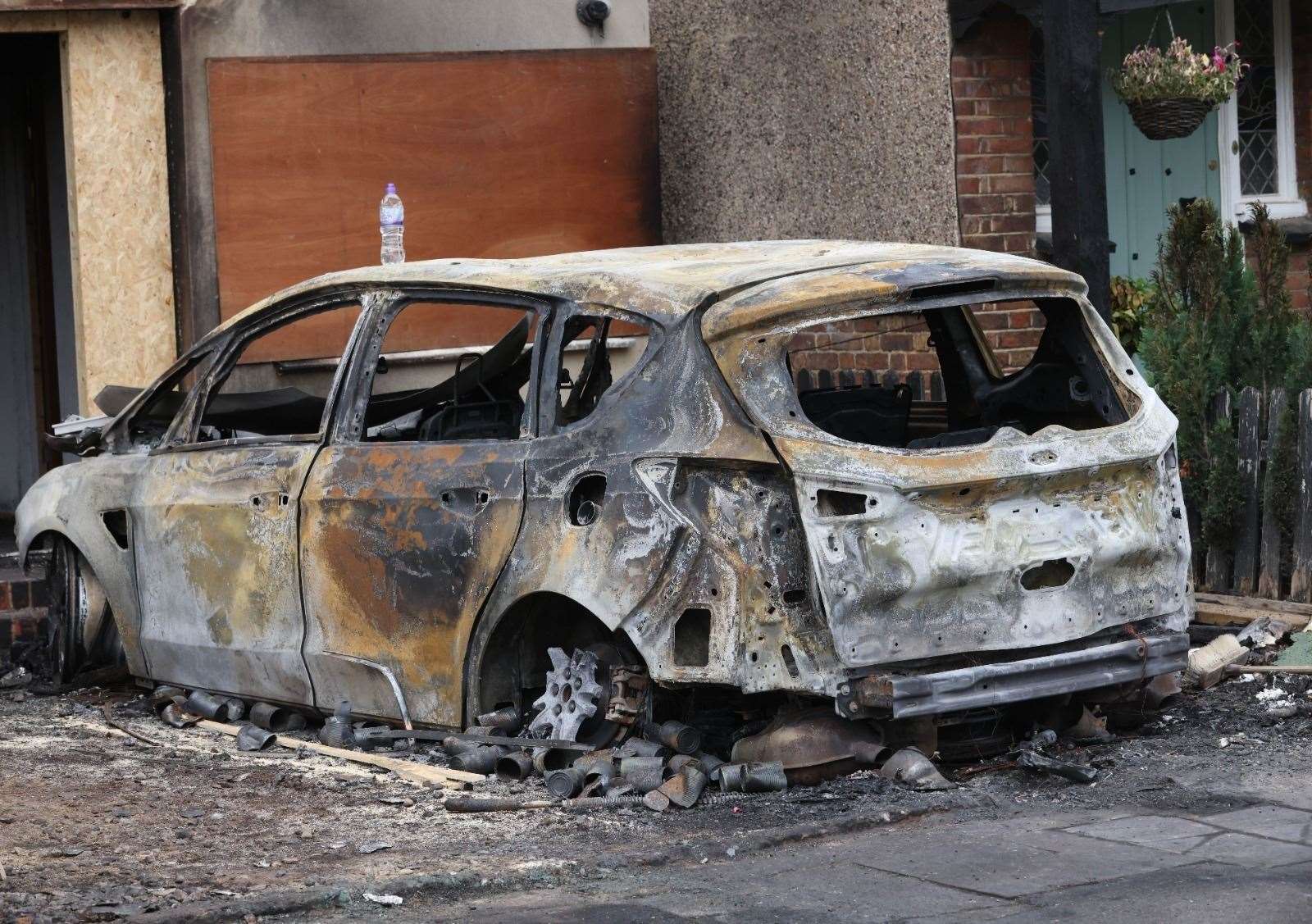 A car was set on fire outside the family home in Welling. Picture: UKNIP