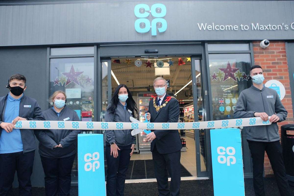 Mayor Gordon Cowan, with manager Amy Vinton and staff, opens the store. Photo by Matt Bristow/mattbristow.net