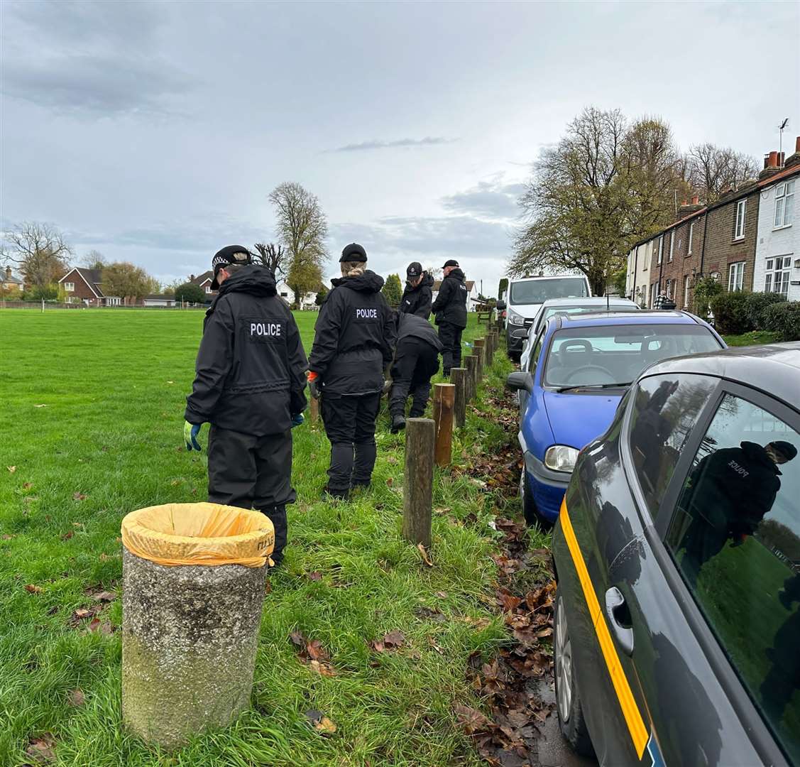 Police searching the historic green in Meopham opposite where a stabbing took place at the Cricketers pub. Pic: UKNIP