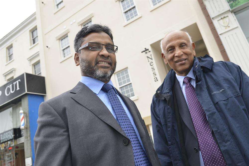 Sirajul Islam and Dr Altaf Hossain at the office building they have transformed into apartments