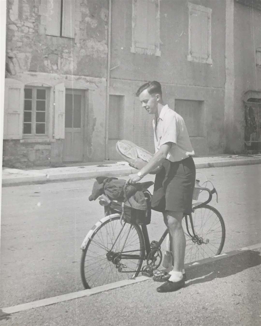 Peter Newman packing lunch for another cycle trip