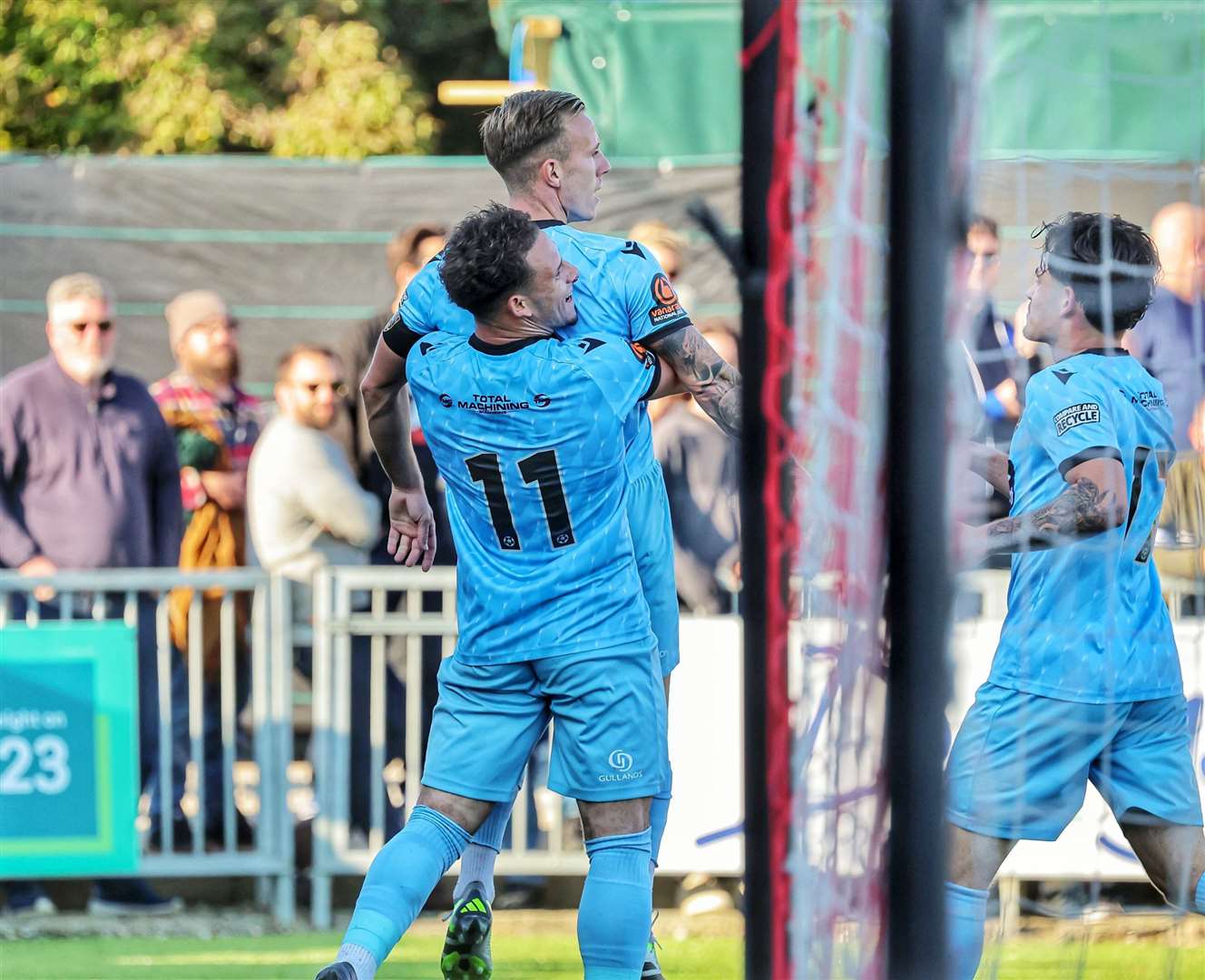 Sam Corne is held aloft by Charlie Seaman after scoring the crucial second goal at Worthing. Picture: Helen Cooper