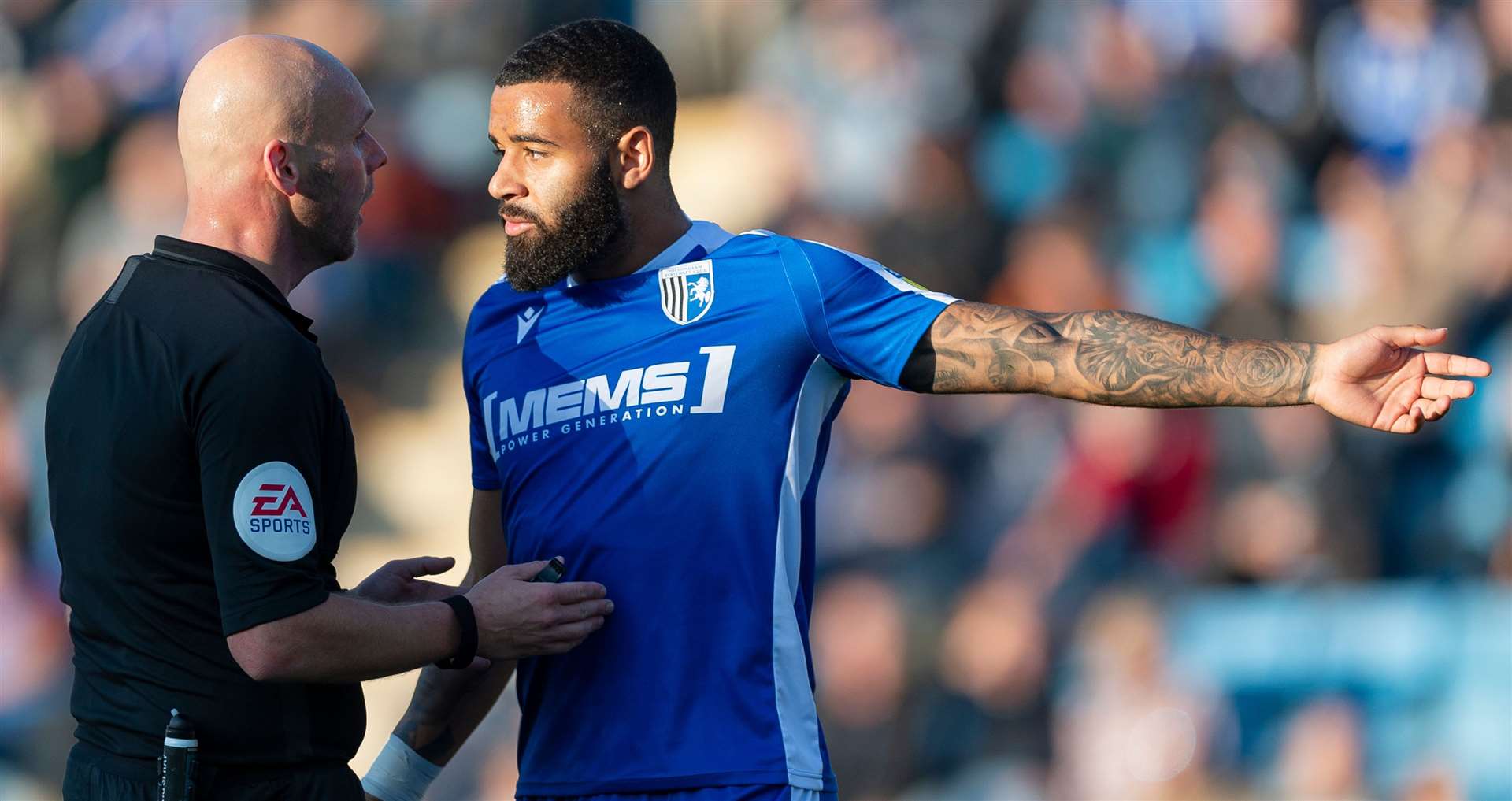 Gillingham substitute Alex Jakubiak has plenty to discuss with referee Charles Breakspear. Picture: Ady Kerry