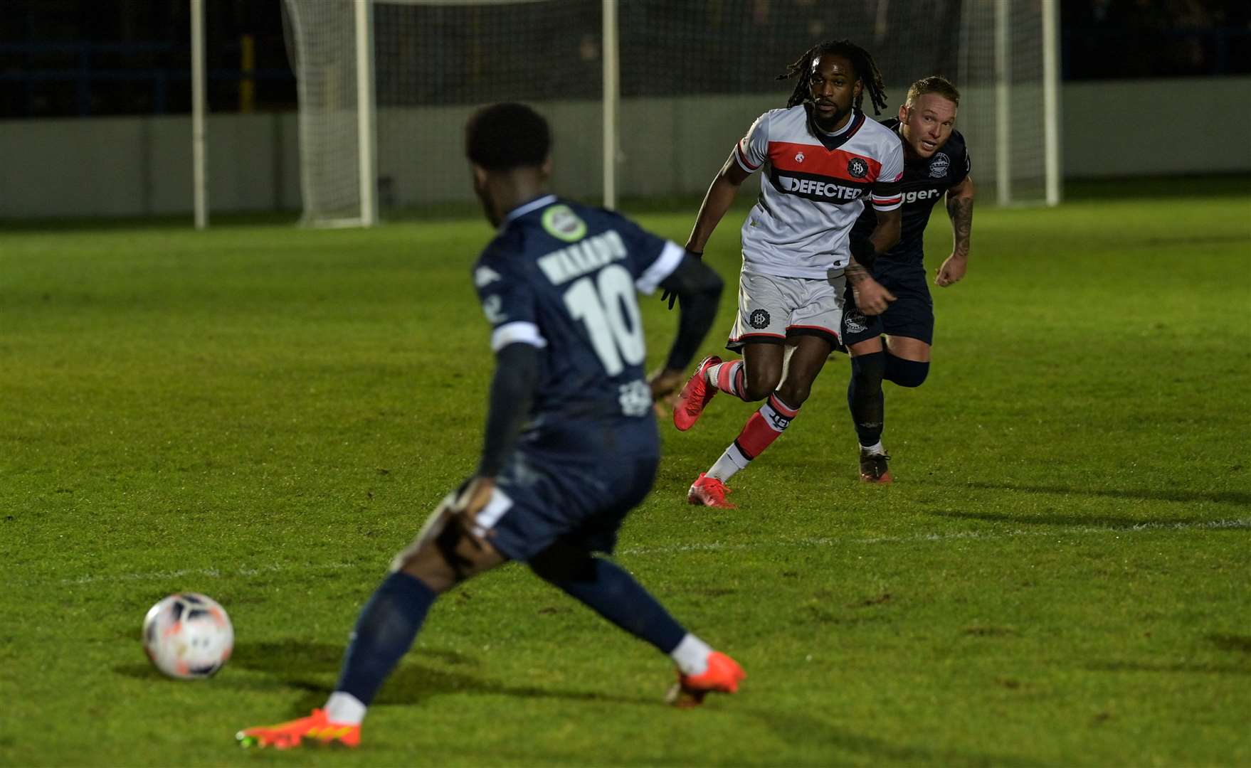 Luke Wanadio gets the ball as Myles Judd makes a run on Dover's right. Picture: Stuart Brock