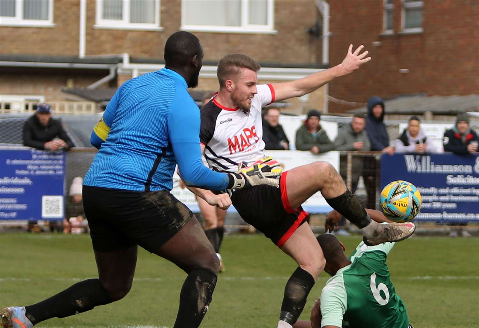 Aaron Millbank and Welling keeper George Kamurasi challenge for the ball. Picture: Paul Willmott