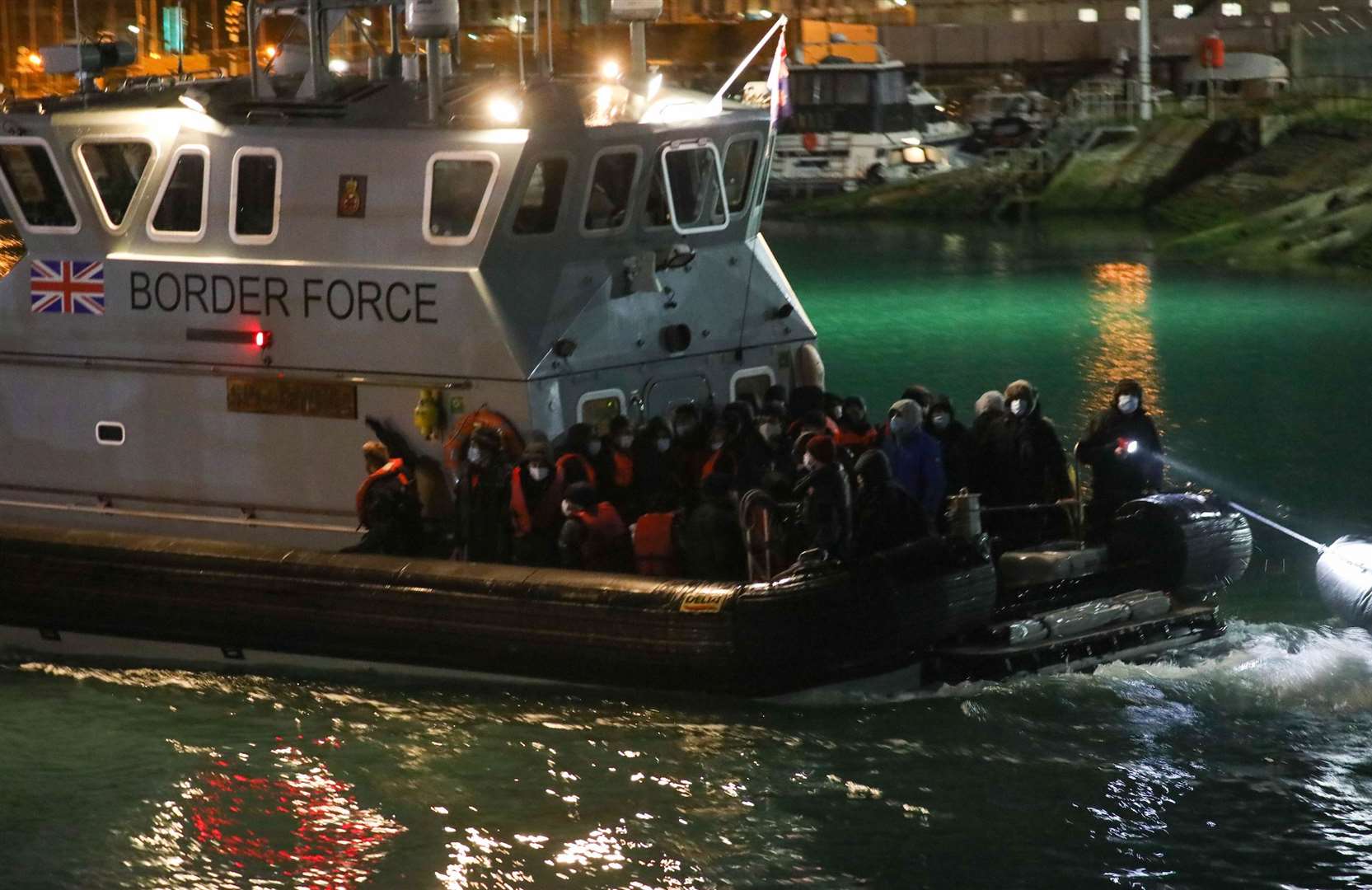 People being brought ashore in Dover on a Border Force vessel