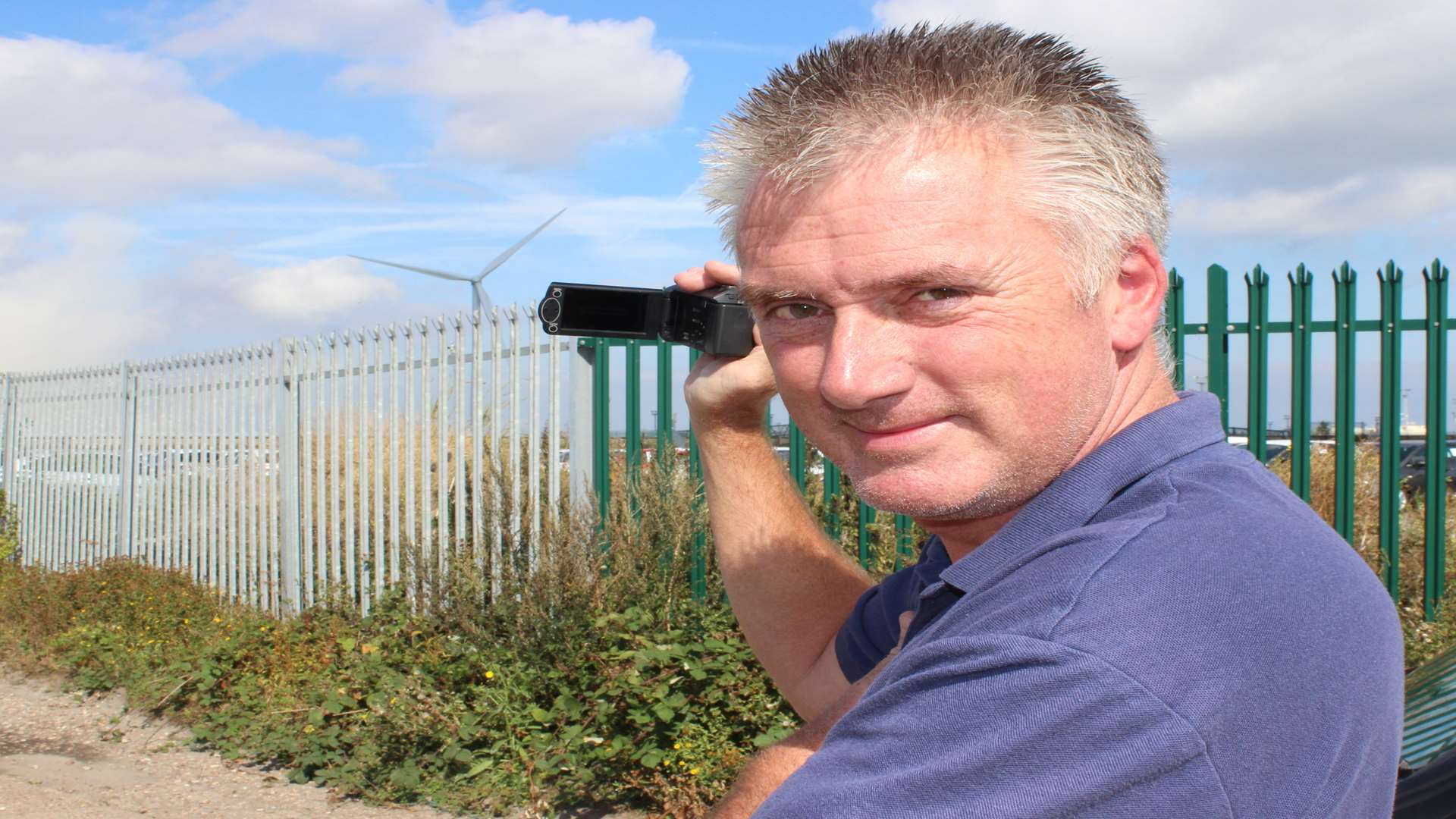 Lee Knowles, 51, of Rettendon Drive, Sitingbourne, bagged himself a prime spot on top of a van to video the Grain power station chimney being blown up on Wednesday morning.