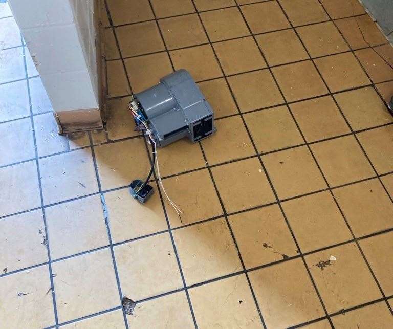 A newly installed hand dryer was knocked off the wall. Picture: DDC