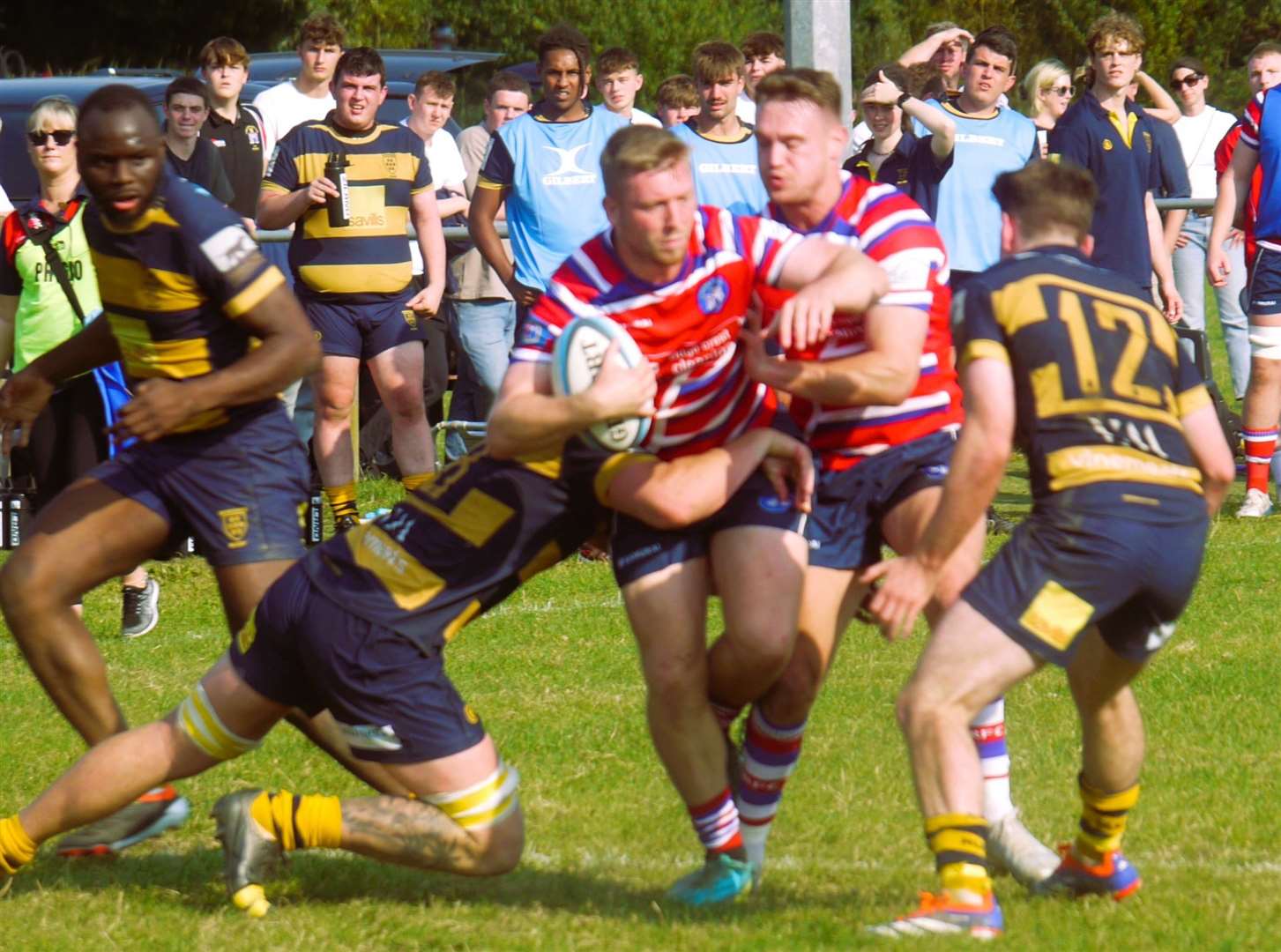 Tonbridge Juddians' Howard Packman is halted by Sevenoaks. Picture: Adam Hookway