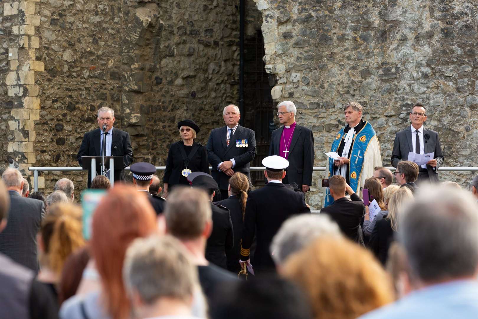 People watch and lay flowers for the Queen at Rochester Castle as the proclamation of the new King takes place. Picture: Medway Council