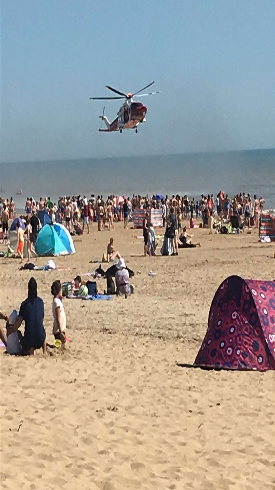 The scene at Camber Sands when five men died last summer