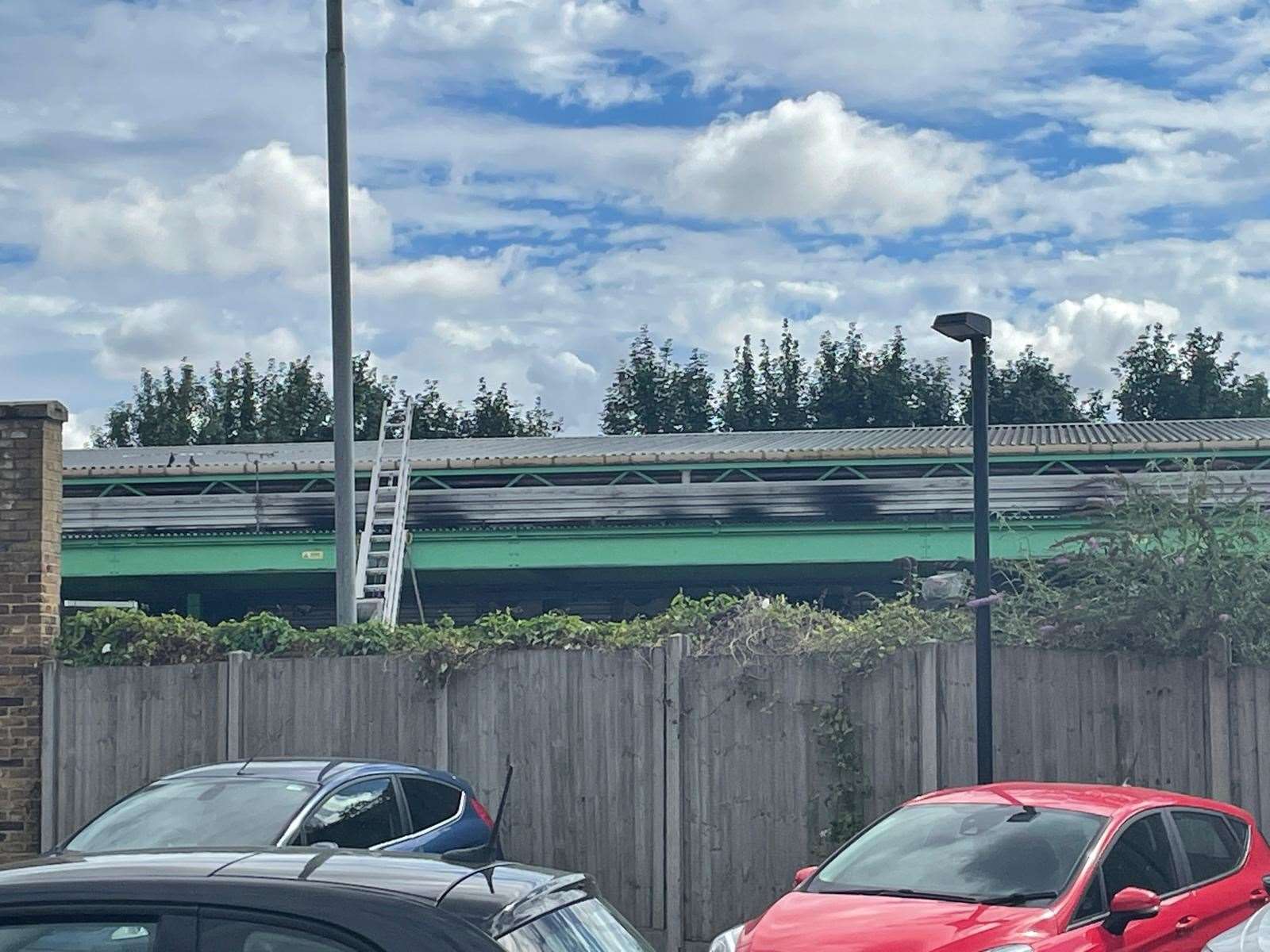 Three schoolboys have been released after a fire was started in a car park