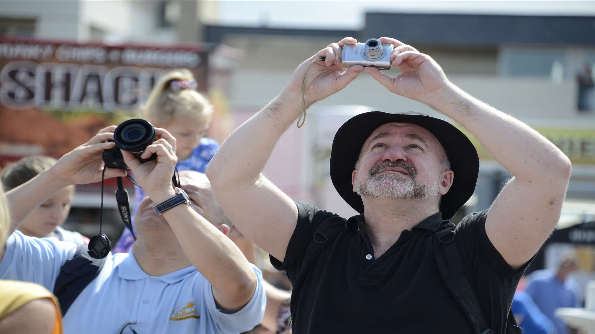 Eyes and cameras to the sky as the planes came thick and fast. Picture: Paul Amos