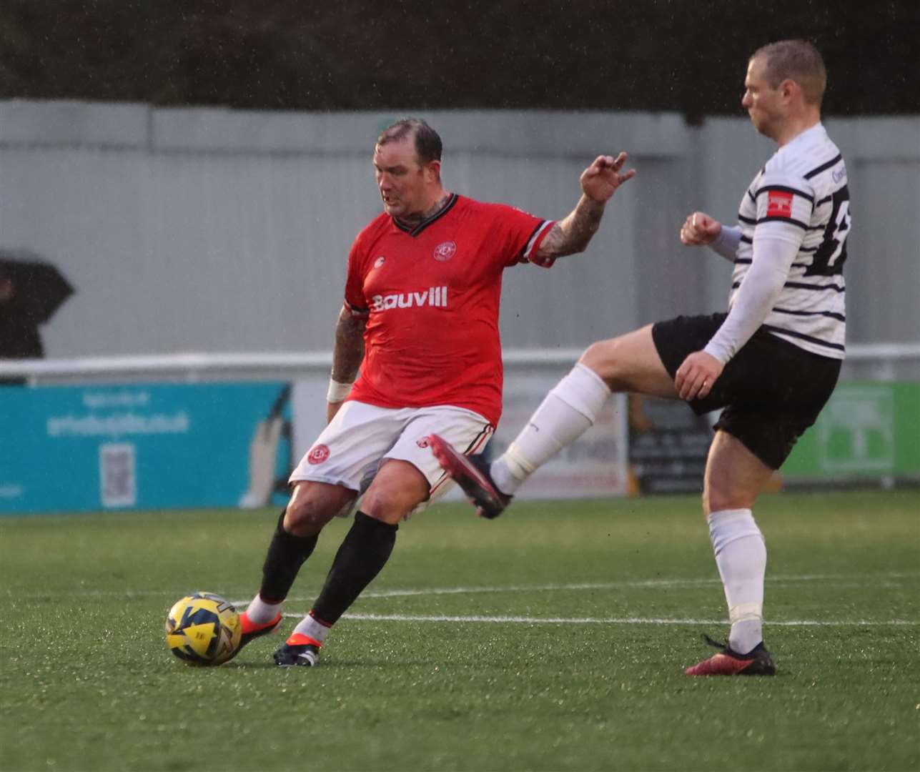 Chatham player-assistant Danny Kedwell is closed down by Margate striker Steve Cawley. Picture: Max English (@max_ePhotos)