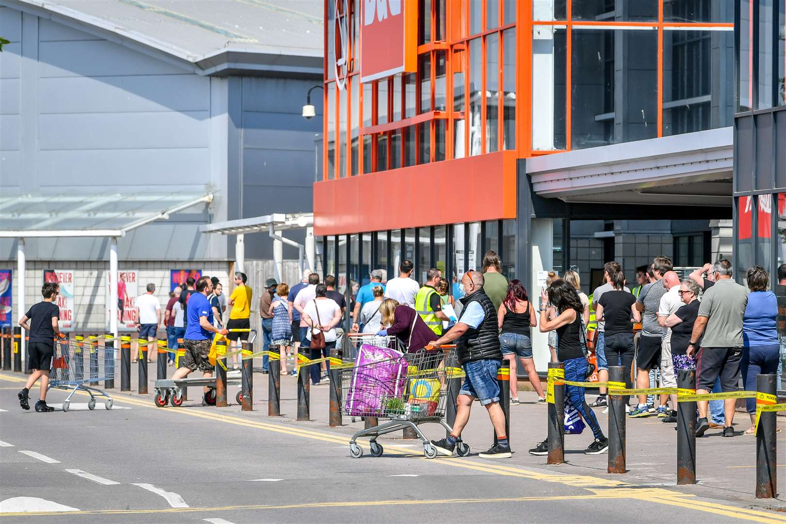 B&Q re-opened many of its stores this week and people in Bristol were pictured waiting to enter (Ben Birchall/PA)