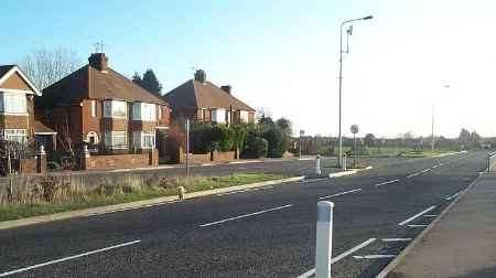 A floral tribute, centre left, near the accident scene. Picture: HELEN COCKERSOLE