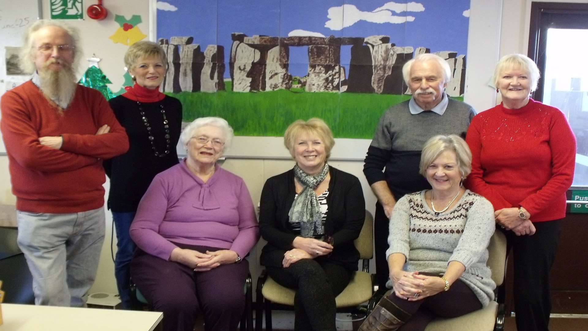 Members of the adult education class and their painting