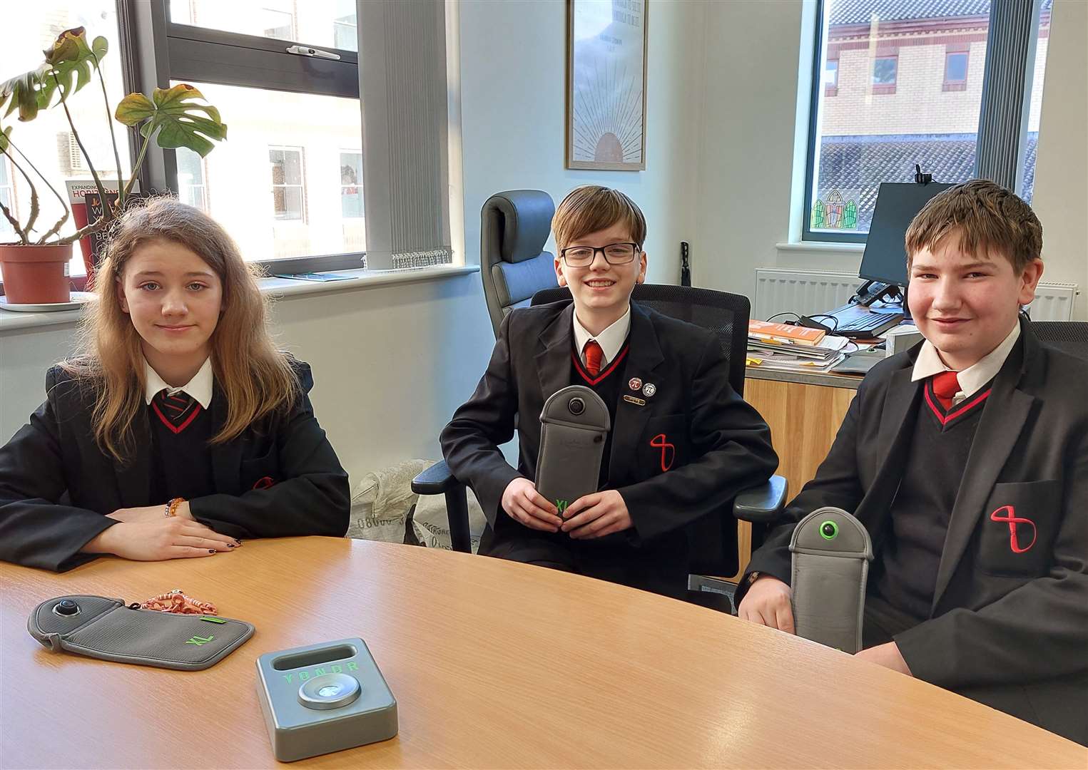 John Wallis Academy pupils Morgan Taylor, Charlie Carr and Jack Bell with their Yondr pouches