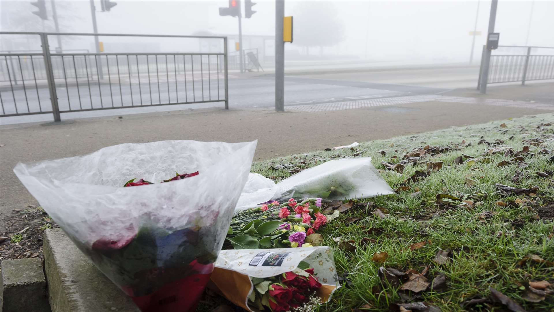 A few floral tributes at the scene