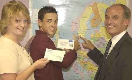 PRIZEWINNER: Marc Warner with Sandra Beal and head teacher Alan Barham. Picture: ANDY PAYTON