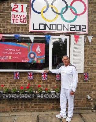 In 2012 Michael Jennings was invited to be an Olympic torch bearer. Photo credit: Channel Swimming Association