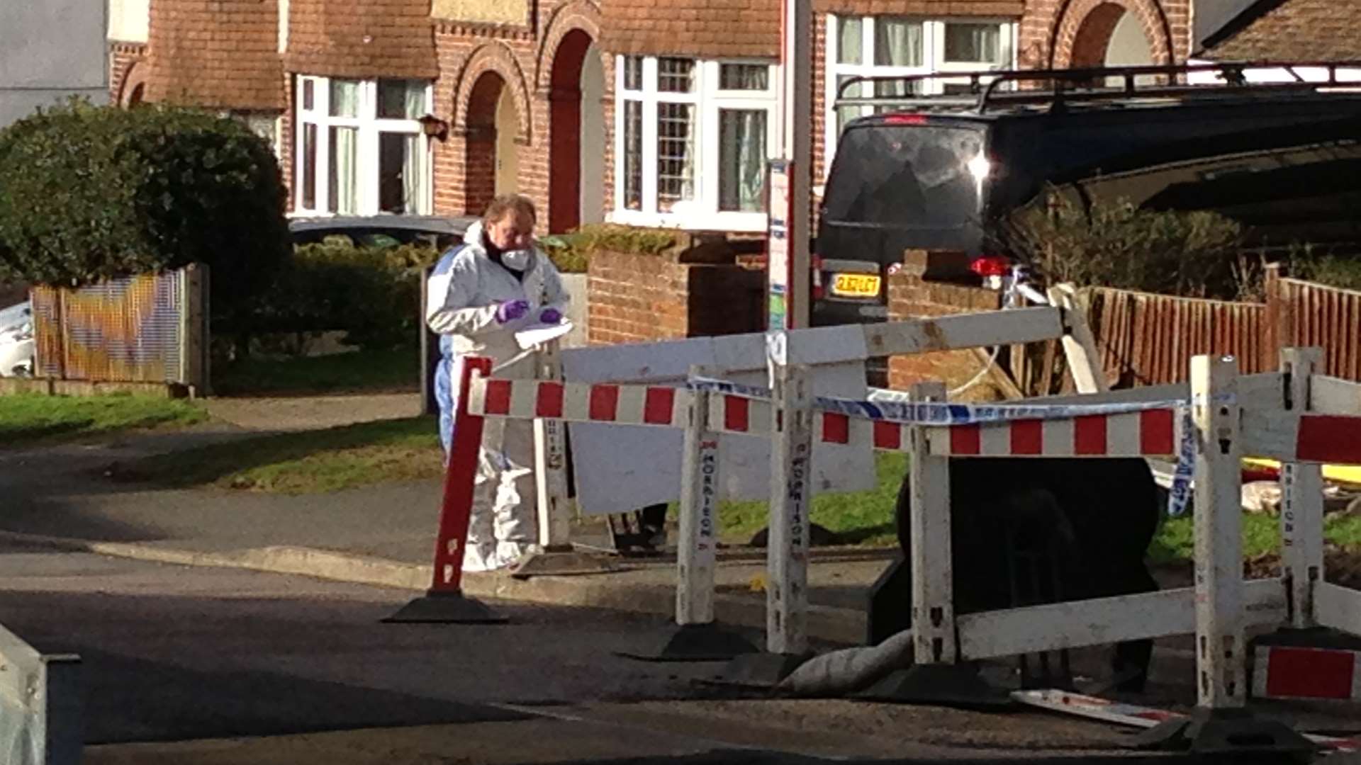 Forensics officers are scouring the street