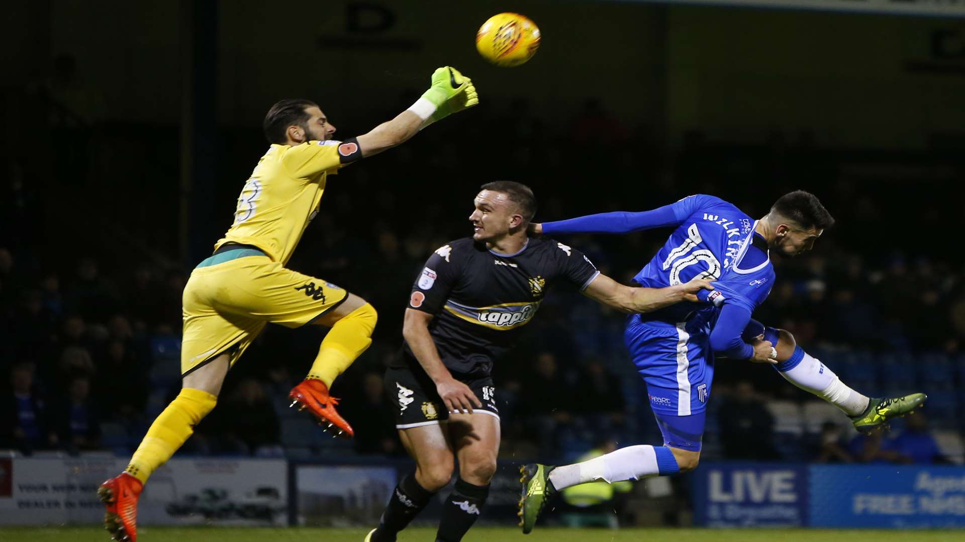 Conor Wilkinson gets stuck in against Bury Picture: Andy Jones