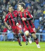 Cody McDonald celebrates after sending Gillingham on their way to a 1-0 win at Oxford