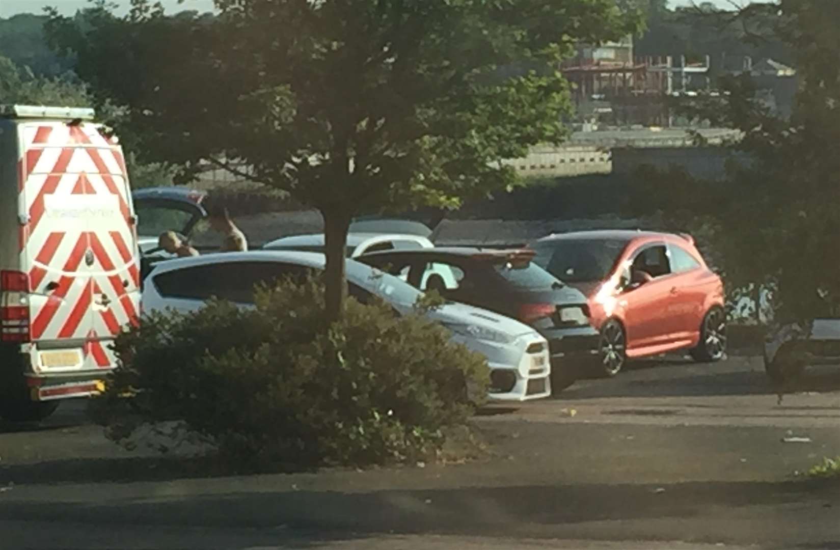 Racing cars arrive at car park