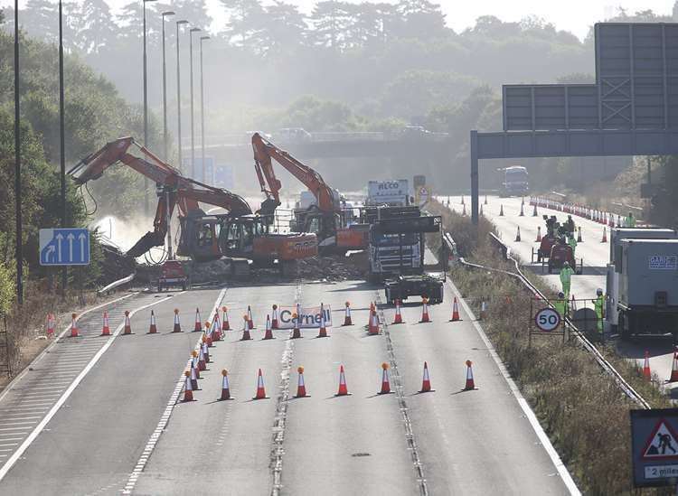 The collapsed footbridge was demolished by specialist teams. Picture John Westhrop