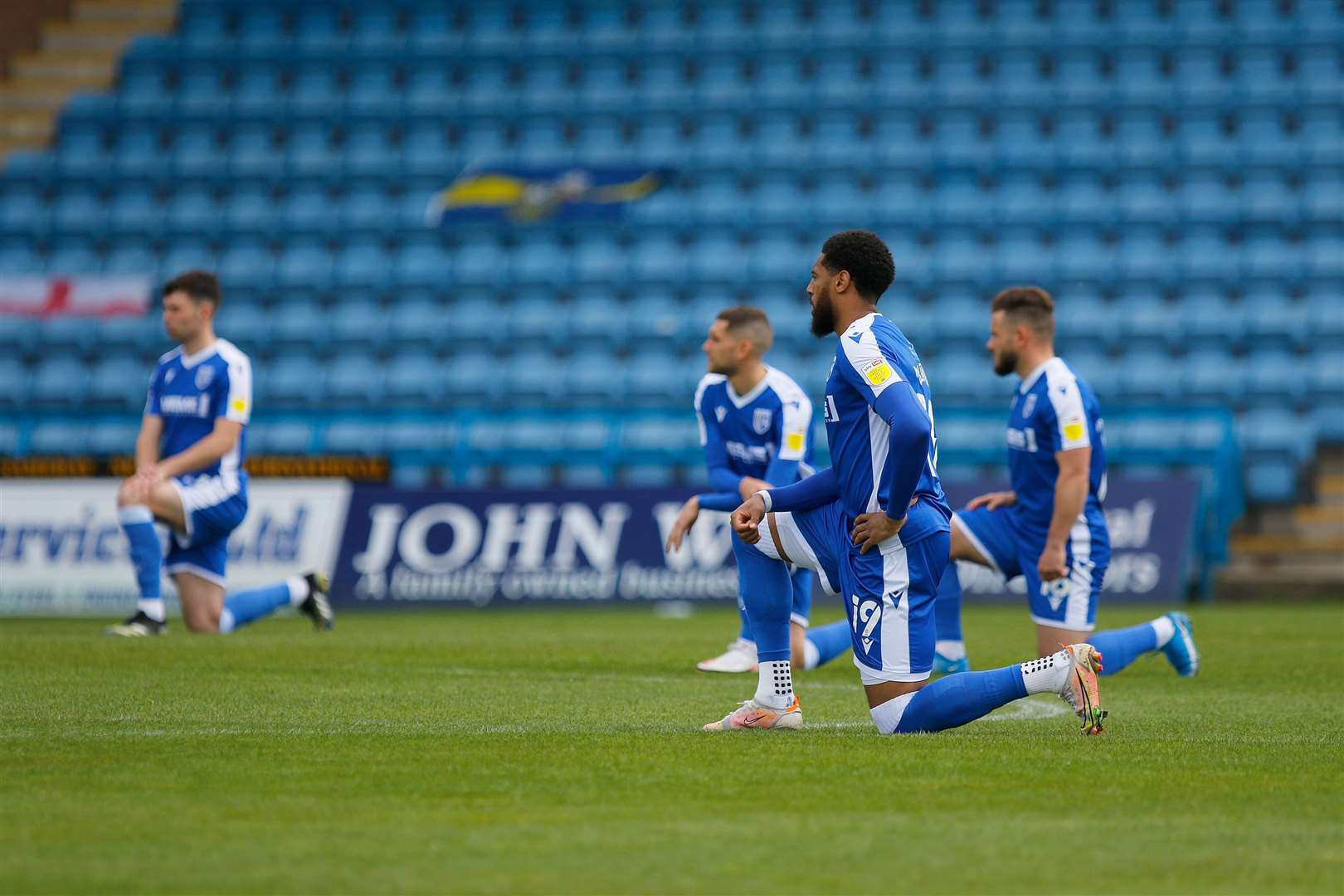 Gillingham and Plymouth Argyle players takes a knee their clash in May