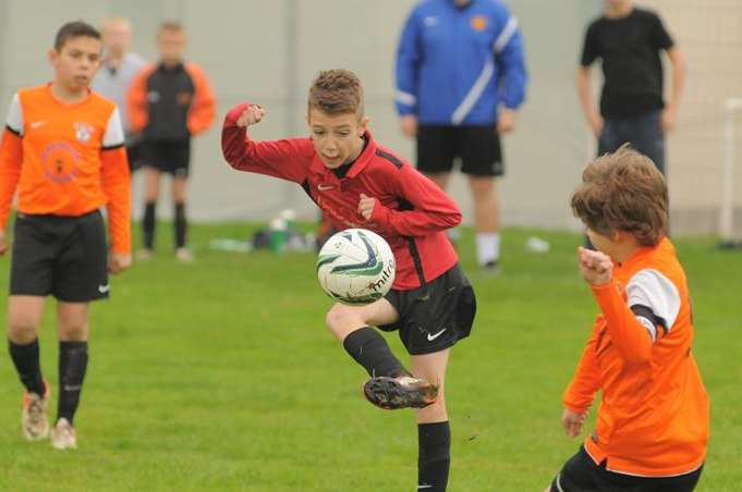 Meopham Colts show close control against Lordswood Youth Tigers in Under-11 Division 3. Picture: Steve Crispe