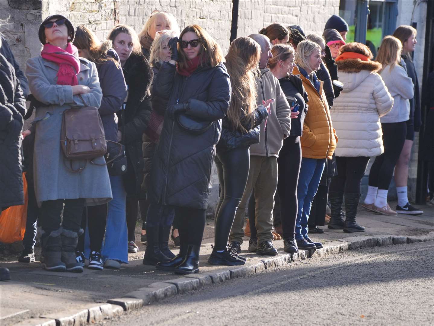 Members of the public line the route to the church (Jonathan Brady/PA)