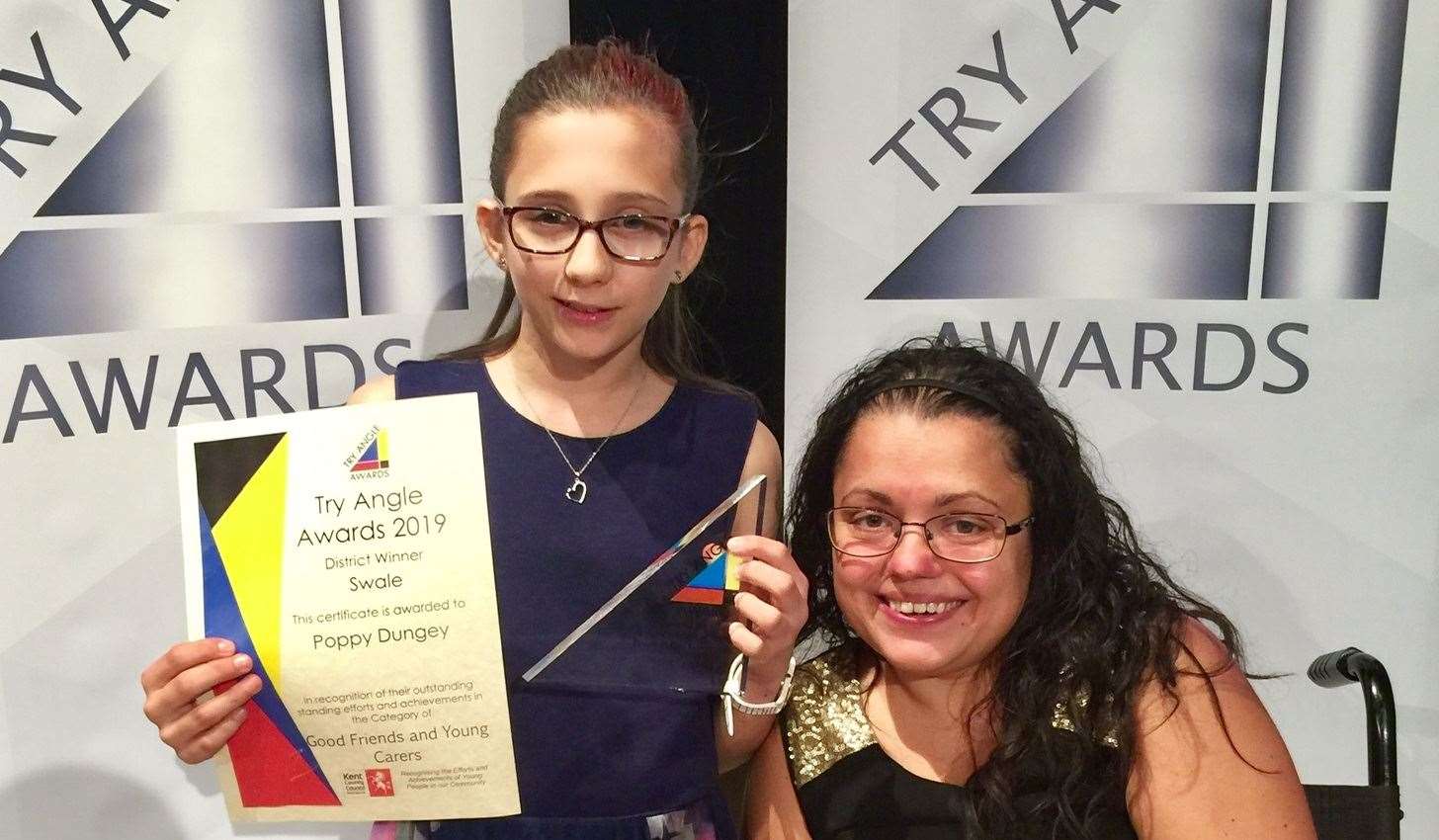 Poppy Dungey with her award and mum Serena Williams