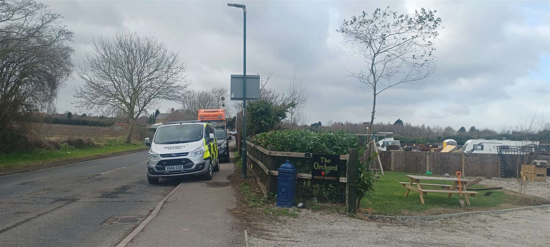 A flat bed lorry pictured waiting outside the site on Monday