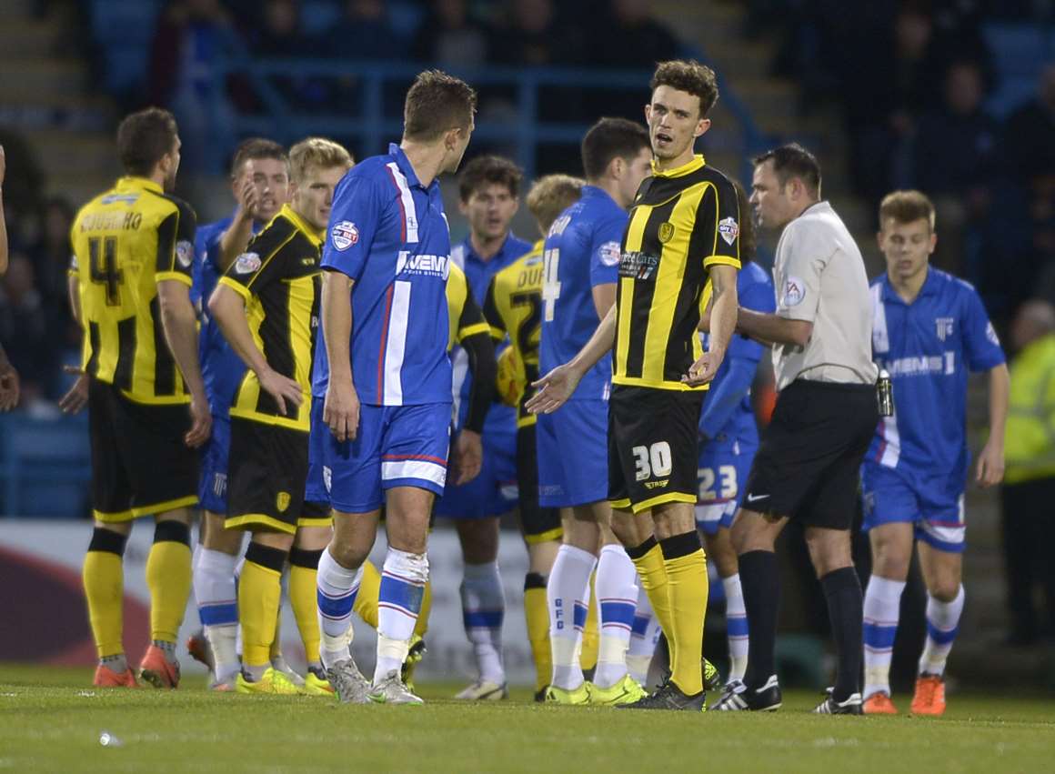 Gillingham players unhappy as Doug Loft is sent off against Burton Picture: Barry Goodwin