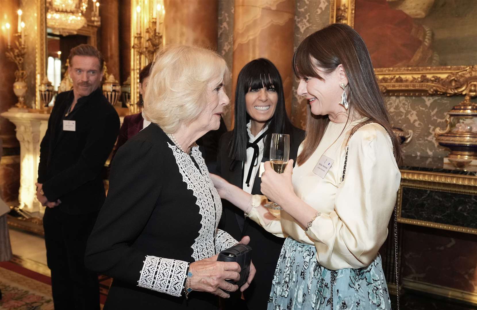 The Queen speaks to Emily Mortimer during a reception to mark the centenary of the Film and TV charity, at Buckingham Palace, London (Aaron Chown/PA)