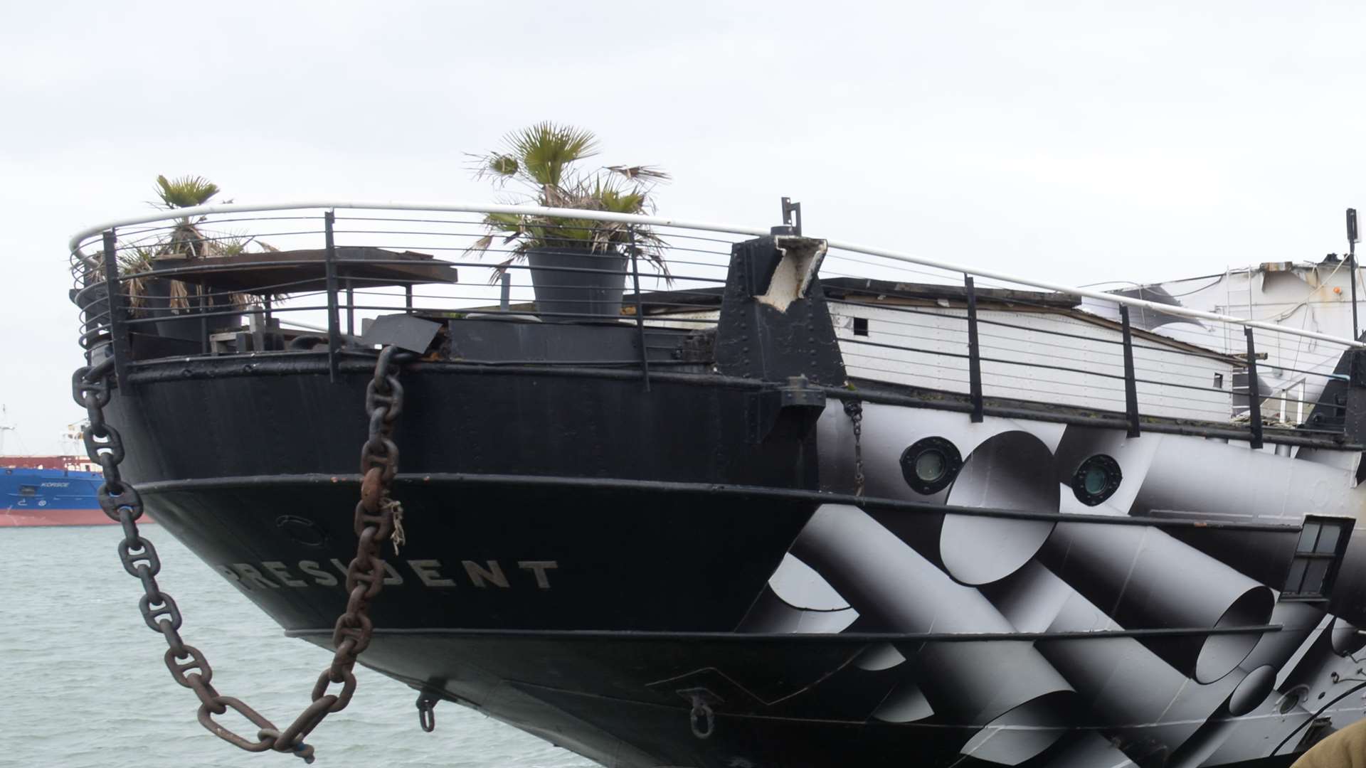 Members of the HMS President Preservation Trust with the ship, currently berthed in Chatham