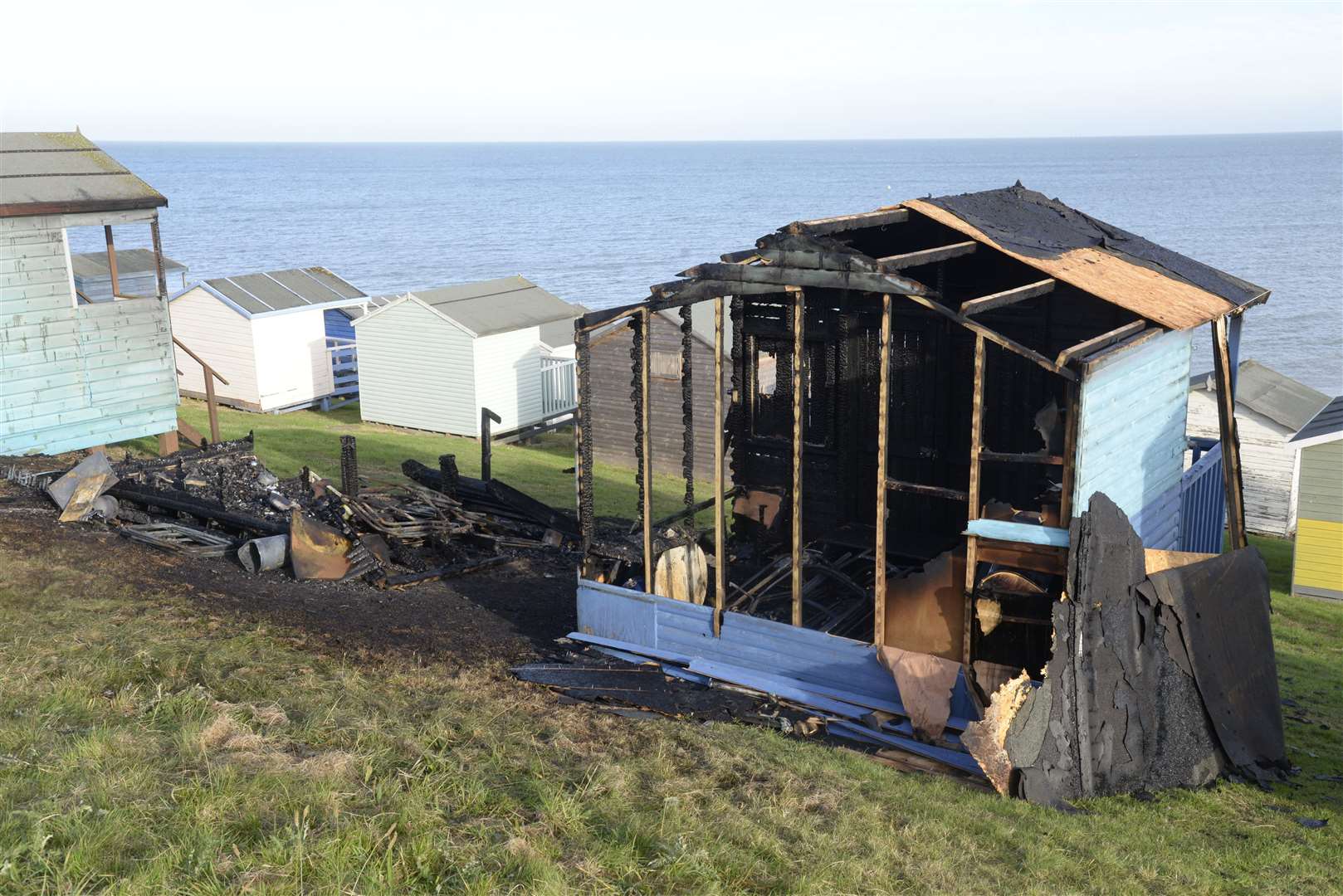 Two burnt-out beach huts back in 2016