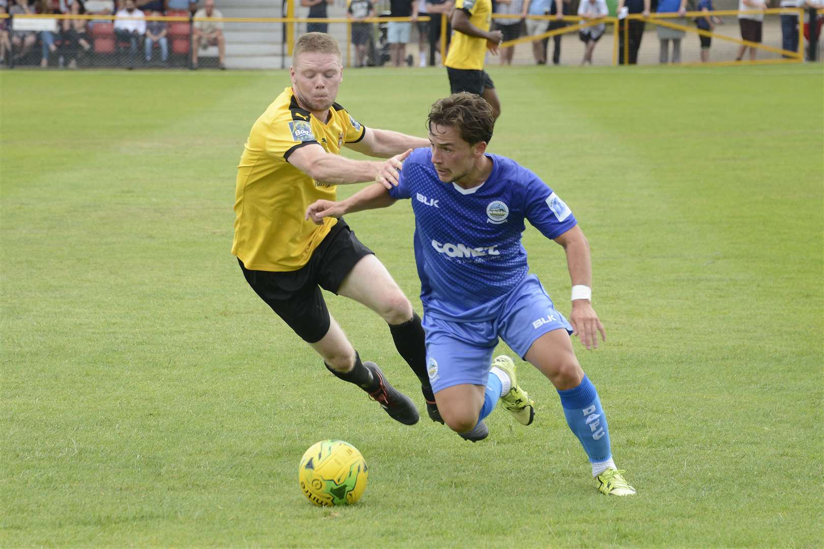 Folkestone's Scott Heard pursues Dover's Jack Munns. Picture: Paul Amos