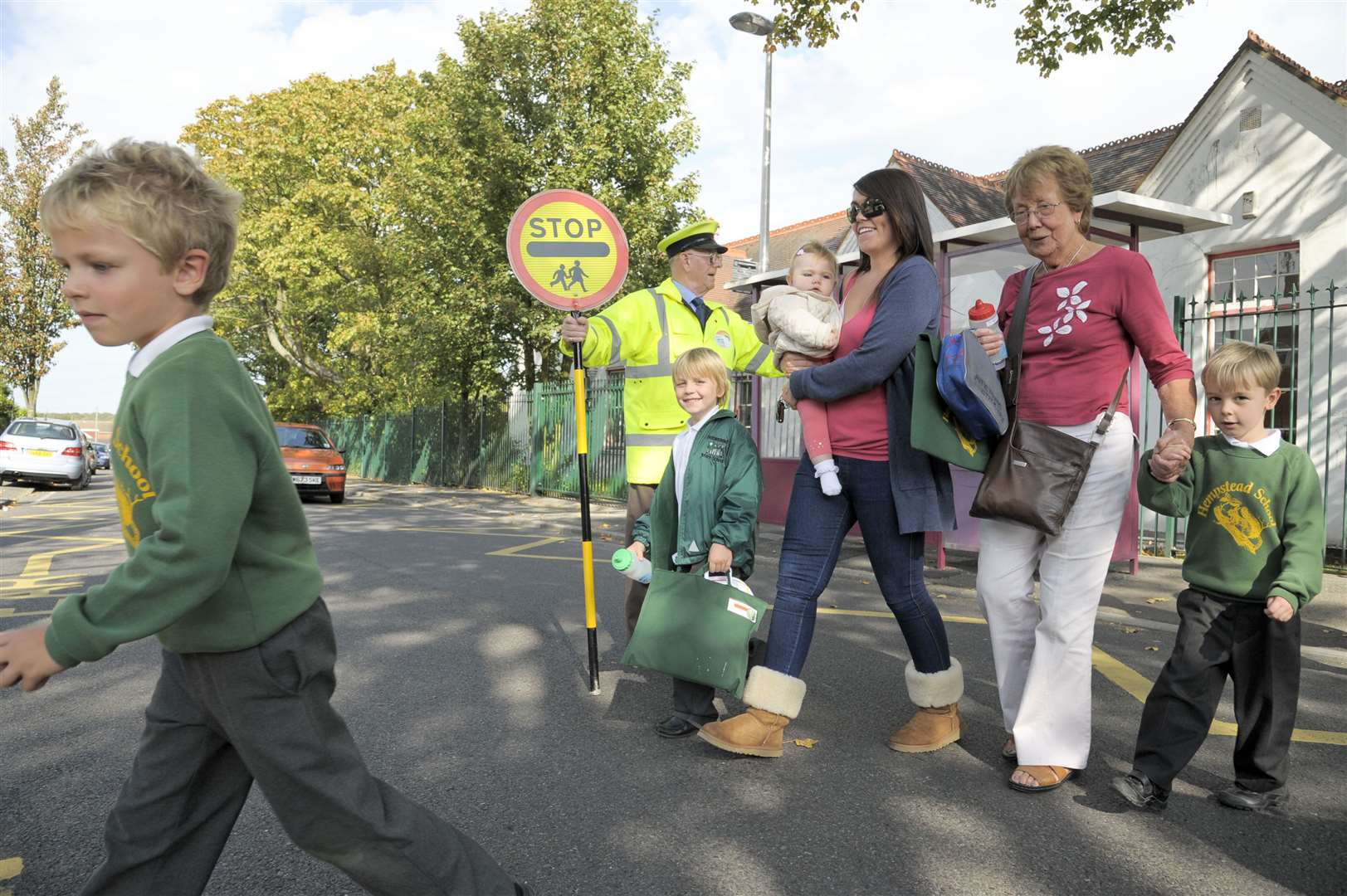 Bill sees his mums and children safely across the road