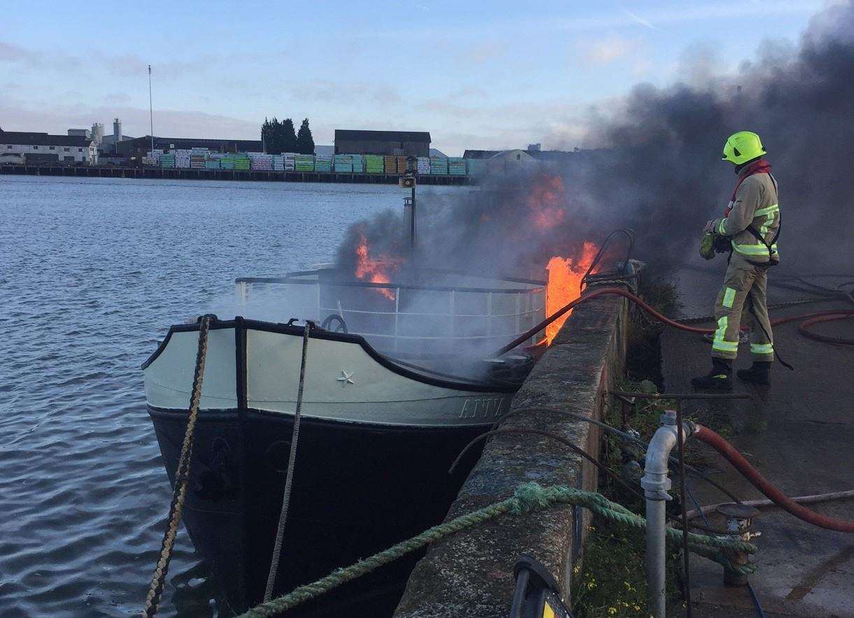 Firefighters tackled the blaze on the 40-foot vessel at Acorn Shipyard