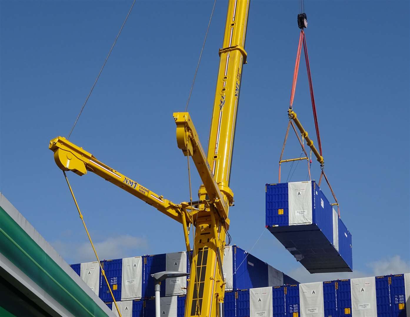 Contractors were seen lifting the containers into place last summer. Picture: Freddie Clements