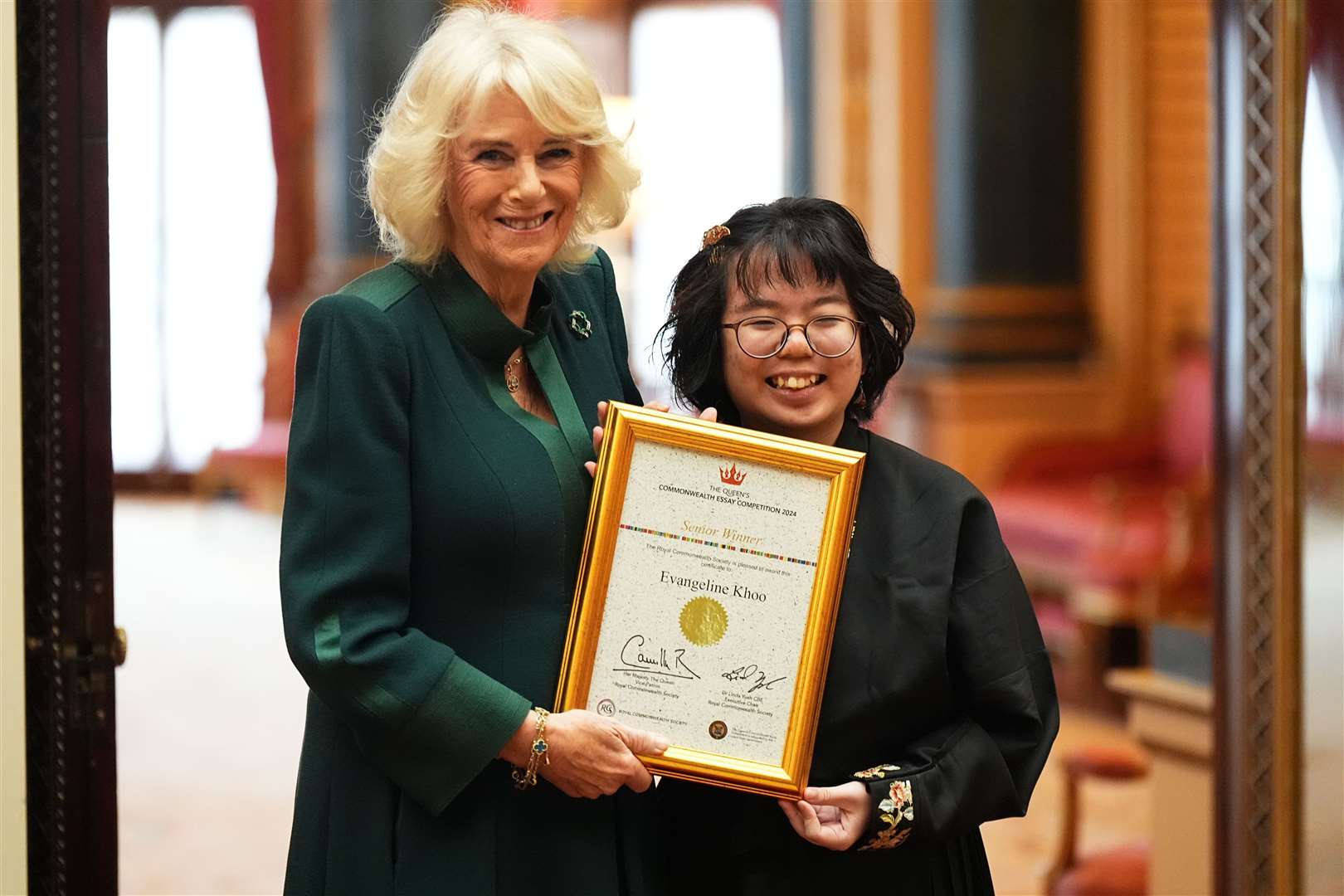 Camilla with Evangeline Khoo, from Kuala Lumpur, Malaysia (Aaron Chown/PA)