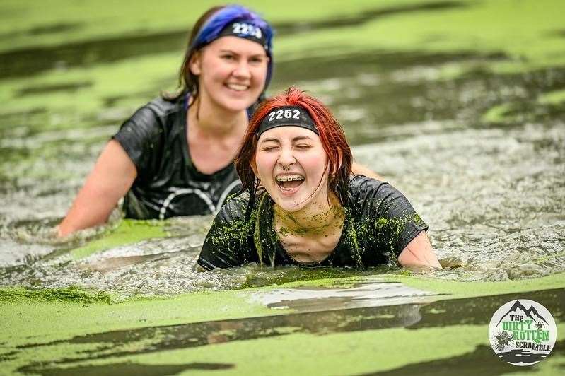 Runners swimming in a pond