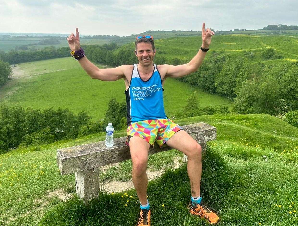 Rick Walton celebrates his record run on the North Downs