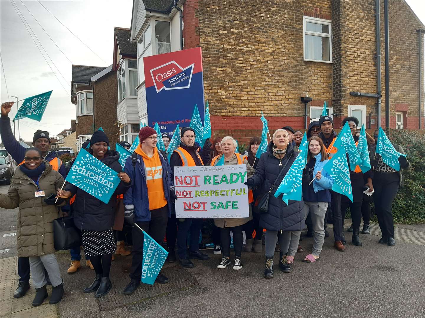 Staff waved banners and placards on the picket line